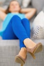 Closeup on young woman laying on sofa