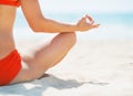 Closeup on young woman meditating on beach Royalty Free Stock Photo