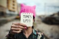 Woman with a pink hat and the text time is up