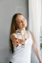 Closeup young woman show glass of water. Portrait of happy smiling female model holding transparent glass of water.Healthy lifesty Royalty Free Stock Photo