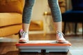 Closeup on young woman training using vibration power plate Royalty Free Stock Photo