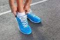 Closeup of Young Woman Tying Sports