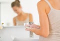 Closeup on young woman washing hands in bathroom Royalty Free Stock Photo