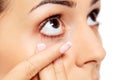 Closeup of young woman wearing contact lens. Royalty Free Stock Photo