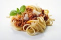 Closeup yummy spaghetti Bolognese served with parmesan cheese and leaves of fresh basil Royalty Free Stock Photo