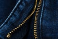 Closeup of zipper in blue jeans. Zipper with lock. A piece of denim Royalty Free Stock Photo