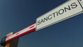Closed barrier gate with SANCTIONS sign. Conceptual 3D rendering