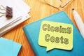 Closing Costs is shown on the conceptual business photo Royalty Free Stock Photo