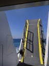 A closing door leveller of Aegean sea ferry with blue sea Greece Royalty Free Stock Photo