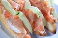 Closuep of salmon sandwiches next to each other