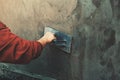 closup hand of workers plastering on wall outdoor in construction site