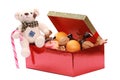 Closup shot of a gift box full of stuff with a teddy bear holding a candy cane Royalty Free Stock Photo