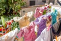 Cloth diapers hanging while drying under the sun on clothesline. Laundry of colorful reusable nappies for babies Royalty Free Stock Photo