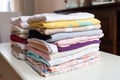 cloth diapers stacked on a baby changing table