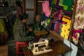 Cloth and fabric vendor, selling bright coloured products at Nyaung Shwe day market, near Inle Lake