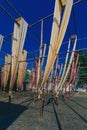 Cloth hanging over wooden poles in a square in the old town of Wuzhen, to showcase local textile dyeing techniques Royalty Free Stock Photo