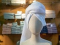 Cloth mannequin head with bath towel wrapped around head in store Royalty Free Stock Photo