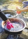 Cloth natural dyeing process, girl soaking cloth in boiled water