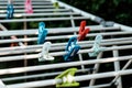 Cloth pegs in multicolor attached to the clothlines Royalty Free Stock Photo