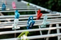 Cloth pegs in multicolor attached to the clothlines Royalty Free Stock Photo