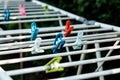 Cloth pegs in multicolor attached to the clothlines Royalty Free Stock Photo