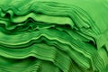 Cloth sports mesh folded into a stack of bright green color close-up.
