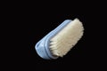 Clothes brush on a black background. Royalty Free Stock Photo