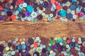 Clothes buttons on wooden baclground Royalty Free Stock Photo