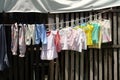 Clothes in a clothes line being hung to dry Royalty Free Stock Photo