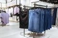 Clothes, denim skirts on racks in clothing store