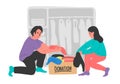 Clothes donation. Young woman and man putting clothes to donation boxes. Royalty Free Stock Photo