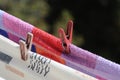 Clothes are dried attached with clothespins to the ropes