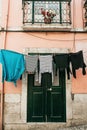 Clothes dry on the street in Lisbon in Portugal. Royalty Free Stock Photo