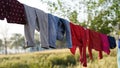 Clothes drying on a clothesline, Clean washing hanging on clothesline hung in backyard Royalty Free Stock Photo