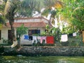 Clothes drying riverside homes Royalty Free Stock Photo