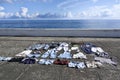 Clothes drying in sunlight on concrete waterfront Royalty Free Stock Photo