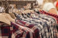 Clothes hang on a shelf . Cloth Hangers with Shirts. Men`s stylish clothes Royalty Free Stock Photo