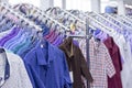 Clothes hang on a shelf . Cloth Hangers with Shirts. Mens business clothes. Royalty Free Stock Photo