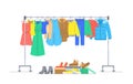 Clothes on hanger rack and shoes in boxes Royalty Free Stock Photo