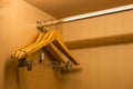 Clothes hanger in wood wardrobe Royalty Free Stock Photo