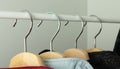 Clothes hangers on the bar in a clothing store. Retail store business illustration, hanger close-up Royalty Free Stock Photo