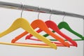 Clothes hangers on metal rail Royalty Free Stock Photo