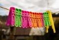 Clothes hangers  outside many colors, green, yellow, orange Royalty Free Stock Photo