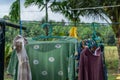 Clothes hanging in clothesline at sunny day Royalty Free Stock Photo