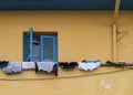 Clothes hanging on the balcony in front of the window of a traditional house in old Nicosia, Cyprus Royalty Free Stock Photo