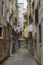 Clothes hanging on a clothesline in a narrow street in Venice, Italy Royalty Free Stock Photo