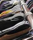 clothes hanging on hangers in used clothing store