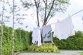 Clothes hanging laundry on washing line for drying against blue sky outdoor Royalty Free Stock Photo