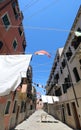 clothes hanging out drying in the sun in the narrow street typic Royalty Free Stock Photo