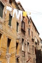 clothes hanging out to dry in an Italian city with  houses Royalty Free Stock Photo